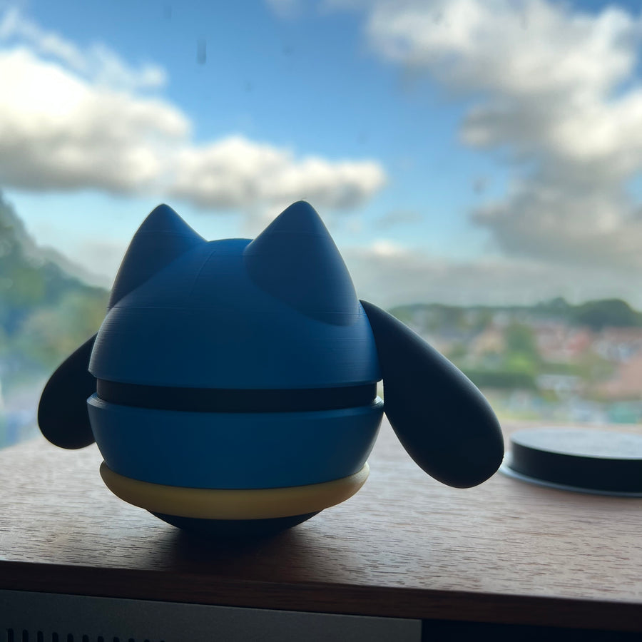 Riolu 3D printed Character Ball on a windowsill, backlit by daylight