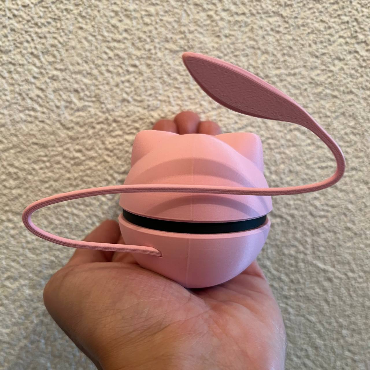Mew Character Ball collectible side view showing the smooth pink finish