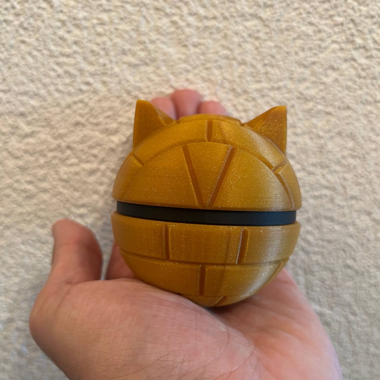 Sandshrew Character Ball collectible side view showing the pale underbelly detail